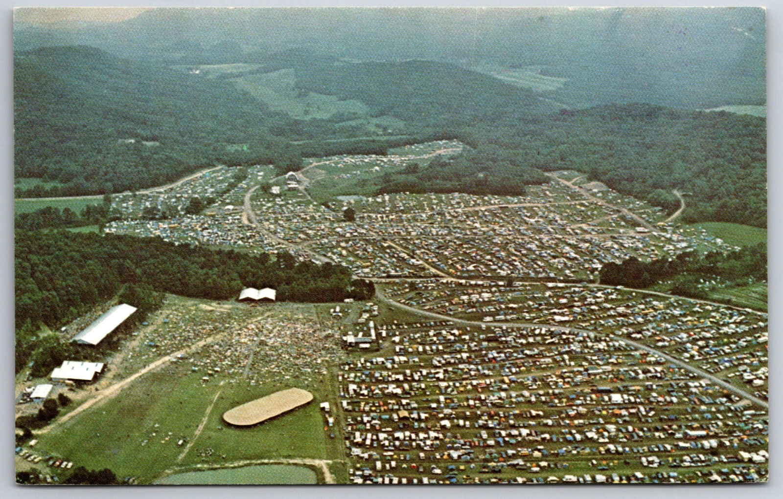 Aerial postcard view of Agape Camp Farm crowded with campers for the annual summer Jesus Event