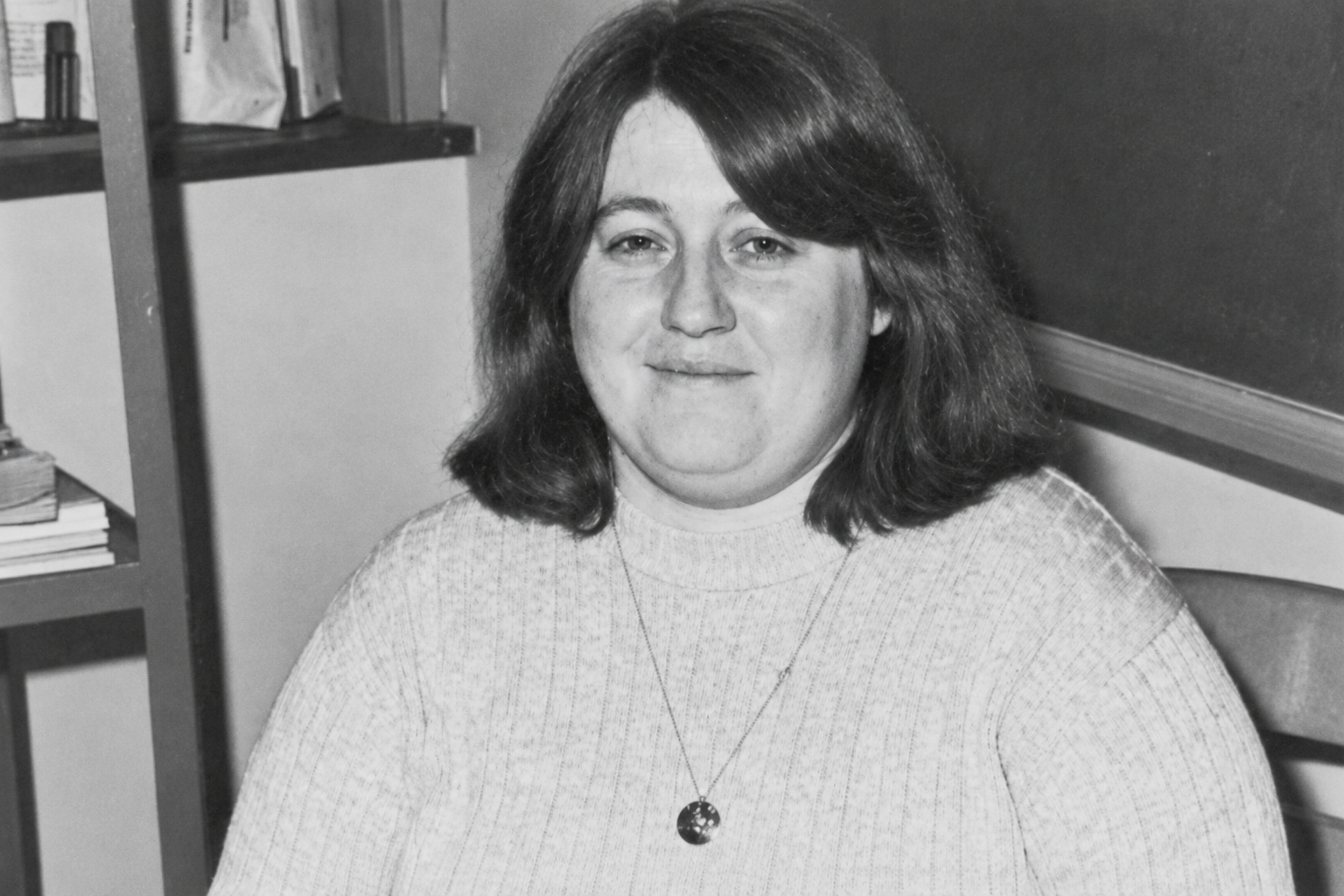 Jane Wagner seated in a classroom