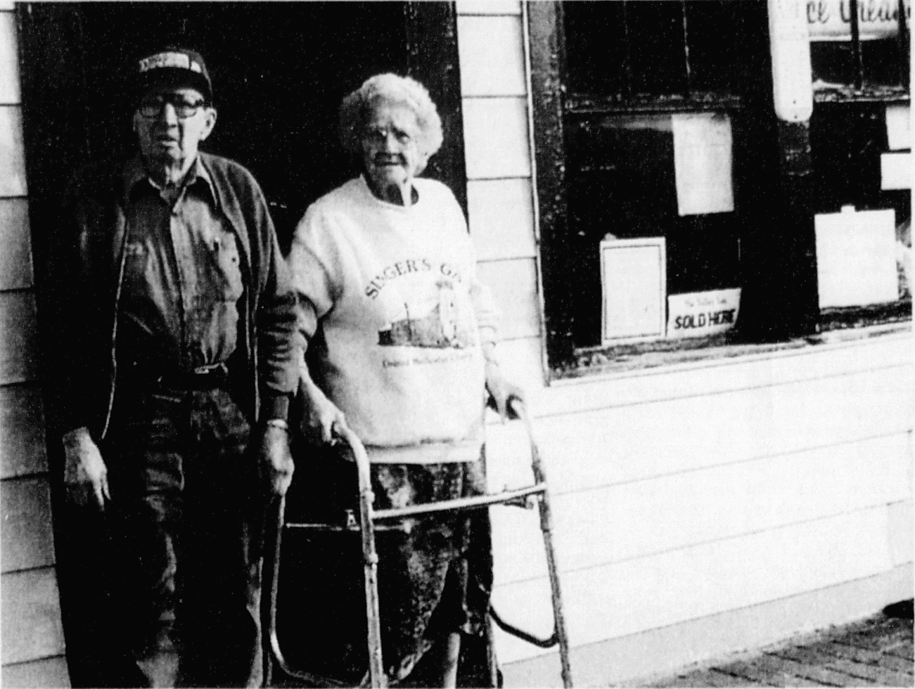 John and Zelda Hancock standing outside their Hill Valley country store in 1999
