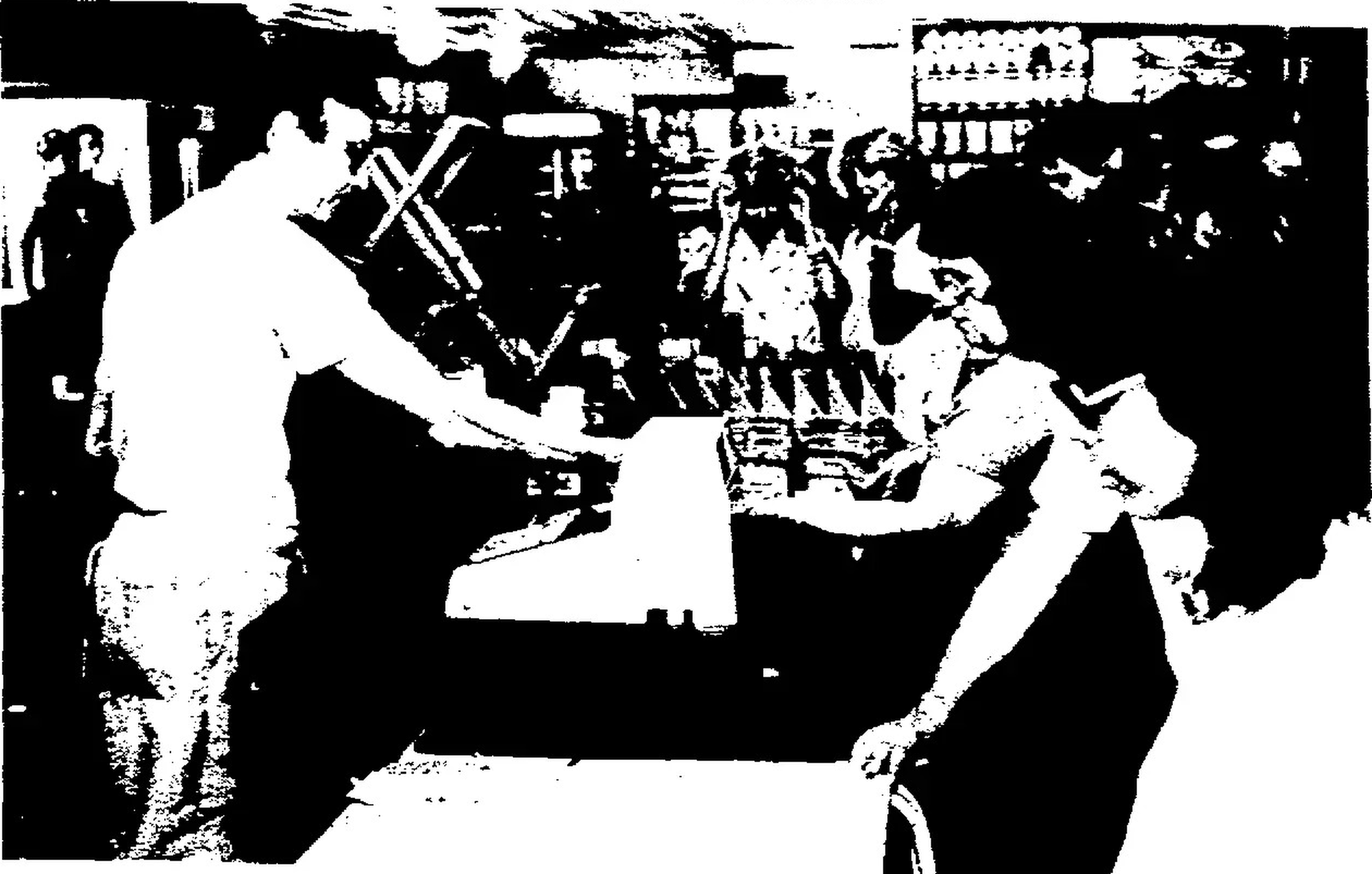 Joe Barrett ringing up a customer at his Creation Festival grocery stand in 1985