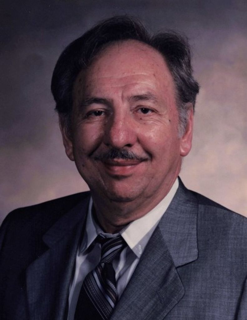 Formal portrait of Mike E. Dimoff Sr. wearing a suit and tie